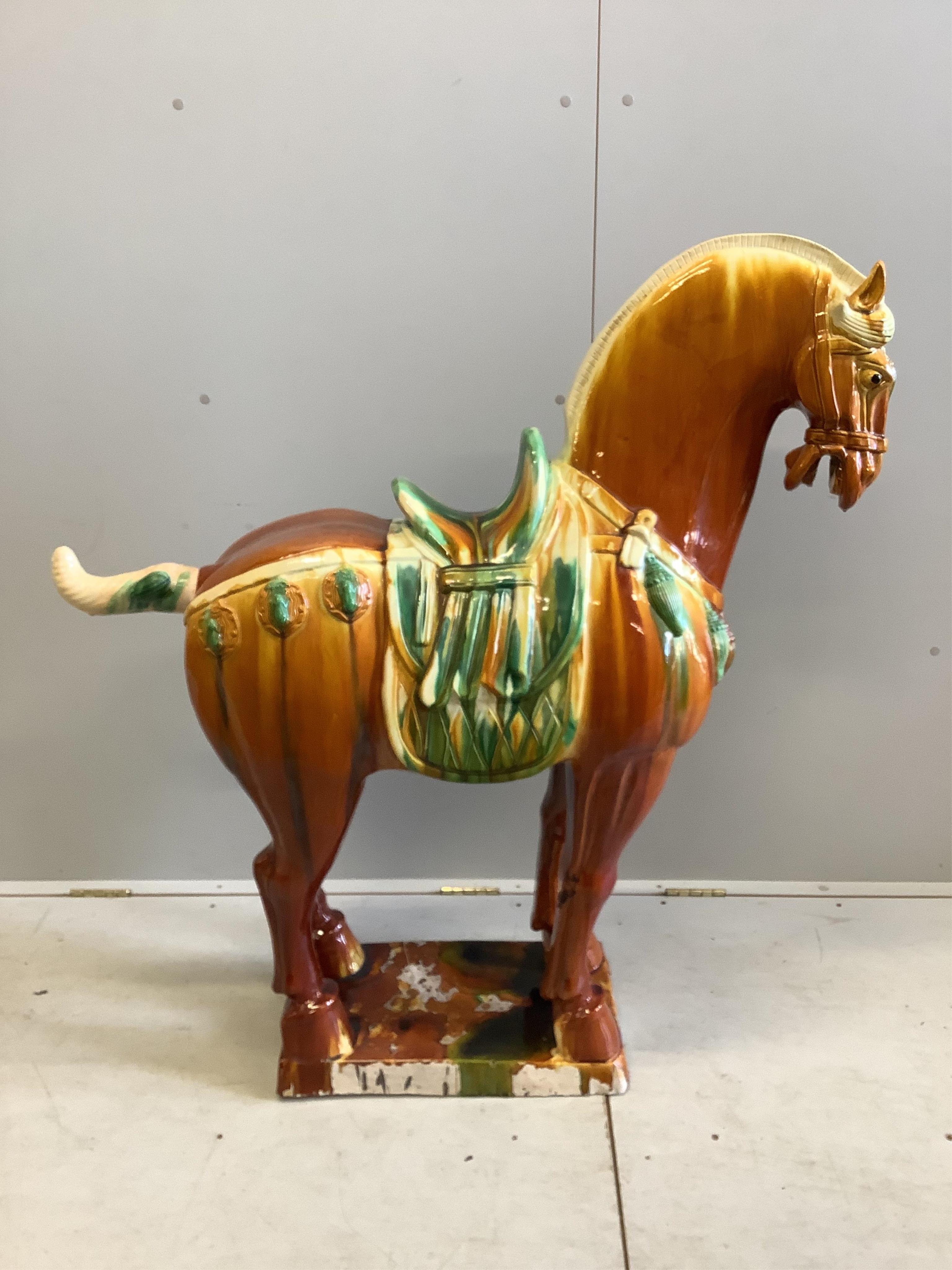 A large modern glazed earthenware Tang style horse, height 114cm. Condition - fair
